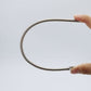 Herramienta pasacintas multiusos plegable con resorte